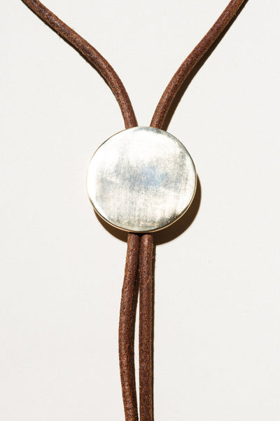 Naked Eyes: Medium Brass Bolo Tie